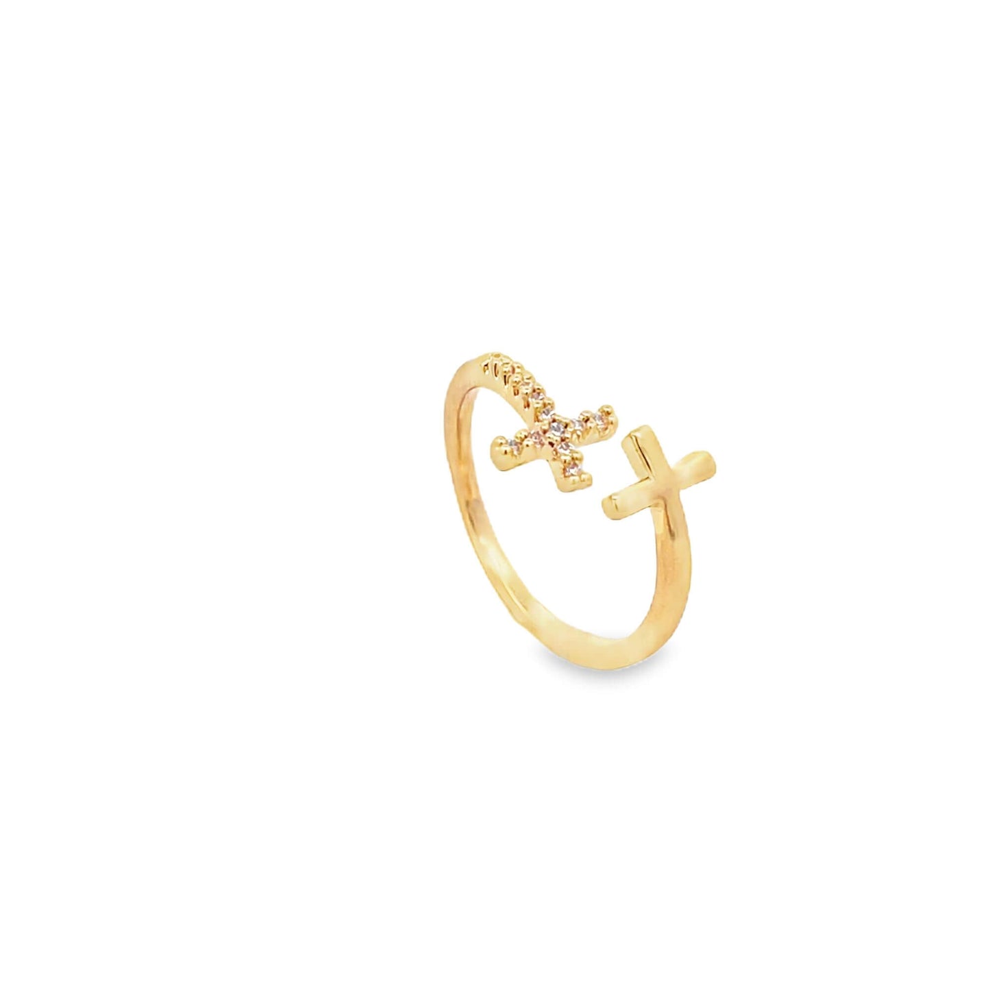 An elegant gold ring features a paved diamond cross and a plain cross design on a white background.