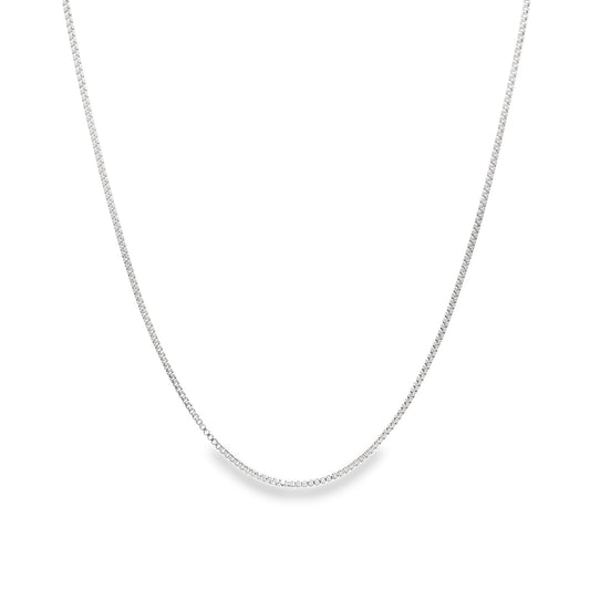 A delicate sterling silver box chain necklace drapes in a smooth curve against a clean white background.