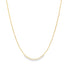 A delicate gold ball chain necklace drapes gracefully against a white background.
