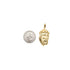 A gold Jesus piece pendant rests next to a US quarter coin for scale.
