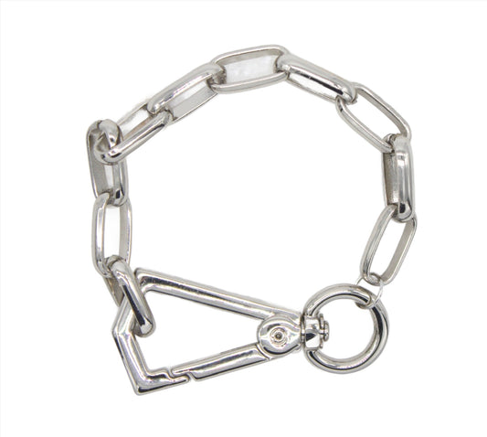 A thick silver paperclip chain bracelet features a large carabiner clasp and a circular ring closure against a white background.