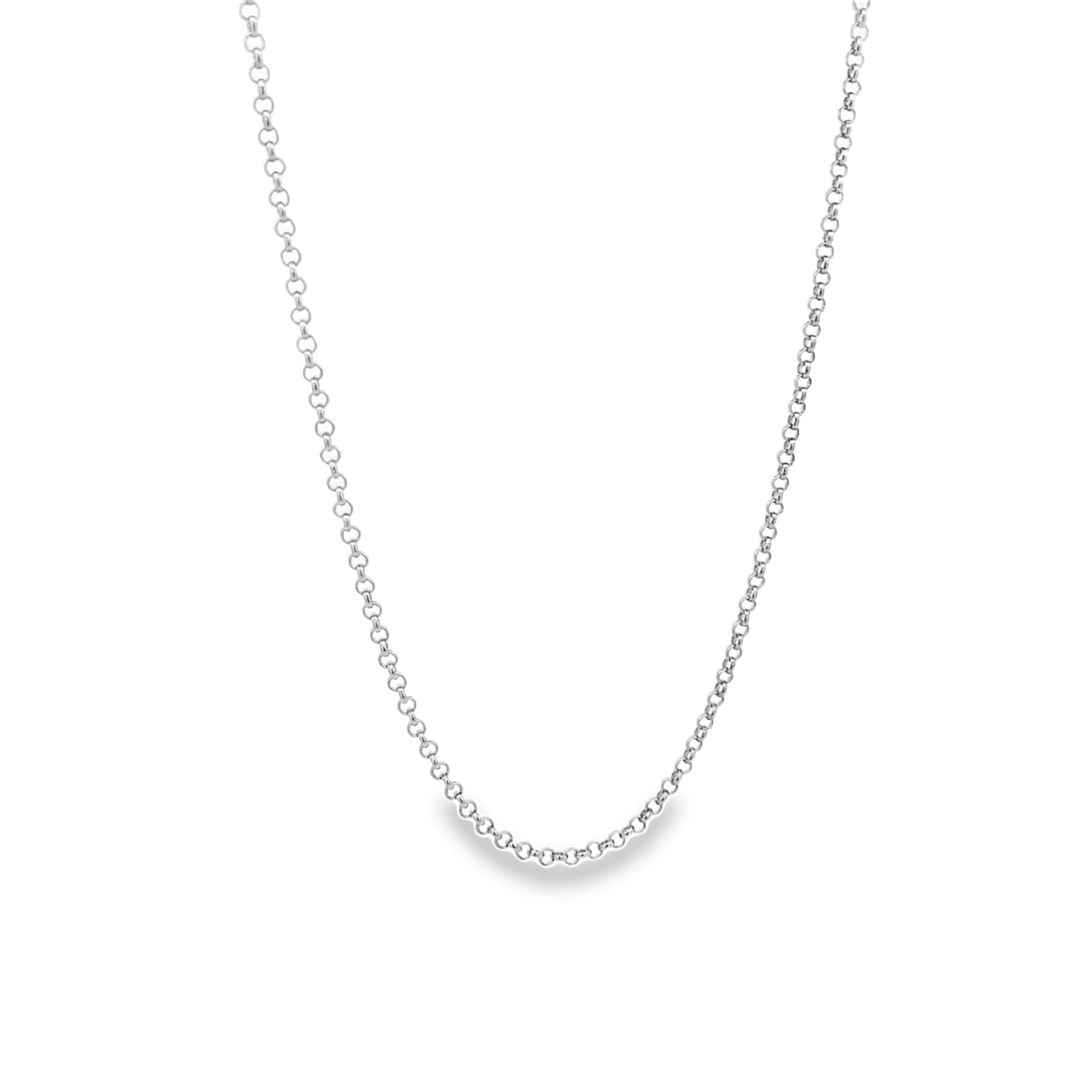 A delicate silver rolo link chain necklace hangs against a plain white background.