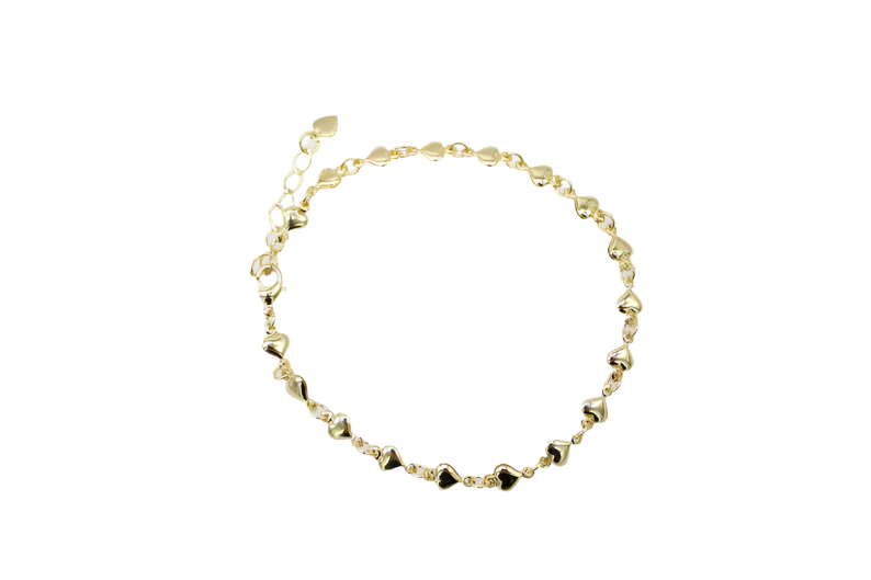A delicate gold chain bracelet features small, polished heart charms arranged evenly along its length.