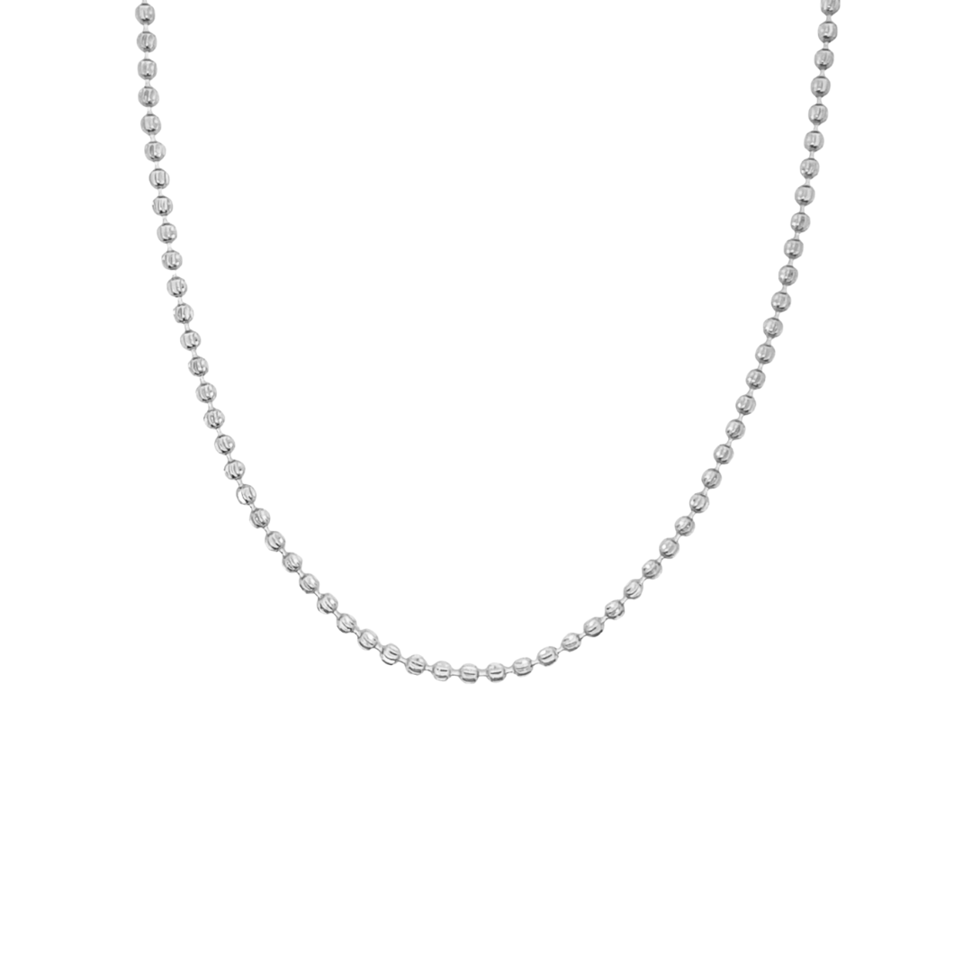A delicate sterling silver ball chain necklace hangs in a graceful curve against a plain white background.