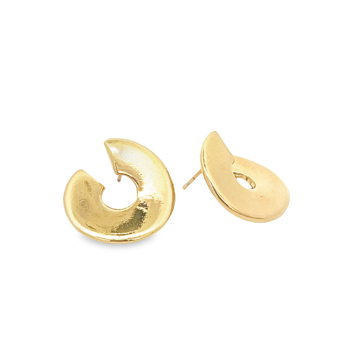 A pair of modern gold stud earrings with a unique abstract curved design rests against a clean white background.