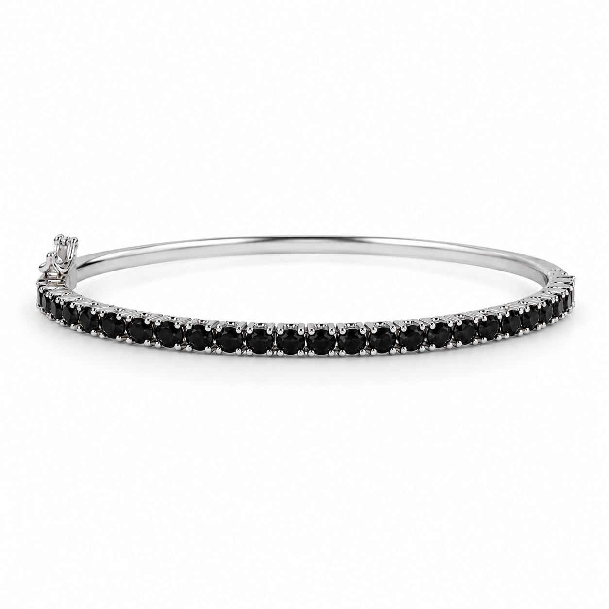 A sterling silver bangle bracelet features a continuous line of sparkling black diamonds set against a plain white background.