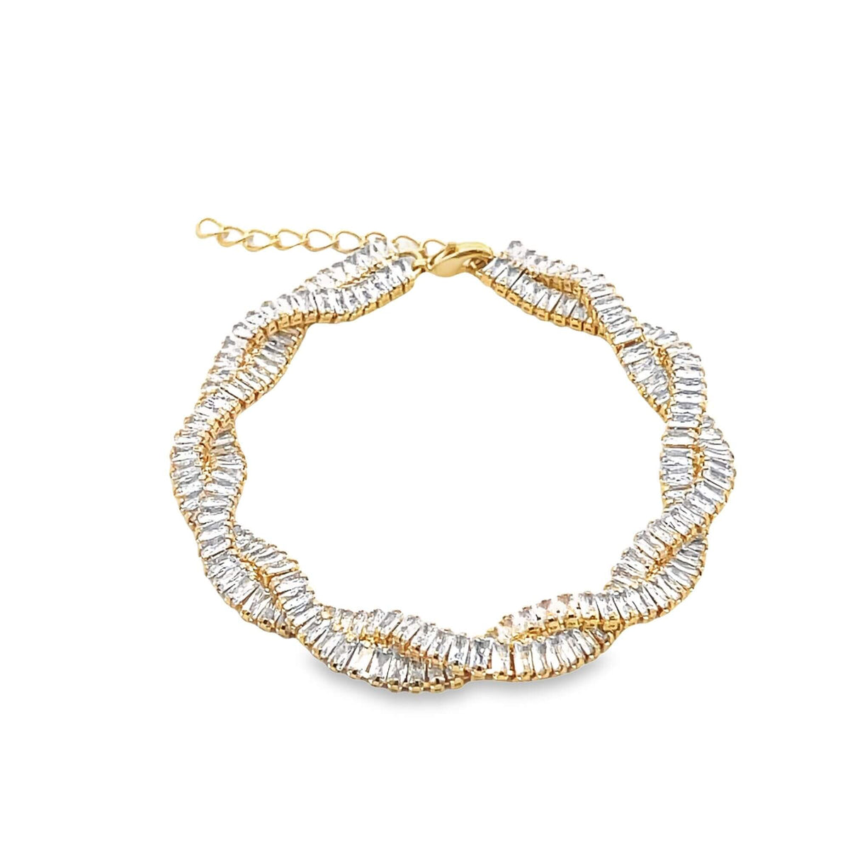 A gold twisted tennis bracelet sparkles with rows of baguette-cut cubic zirconia stones on a clean white background.