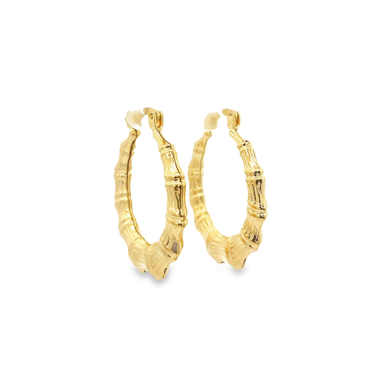A pair of polished gold bamboo hoop earrings displayed on a clean white background.