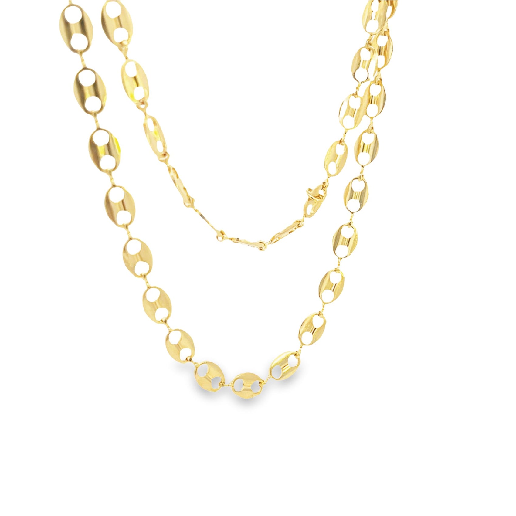 A double-layered gold puff mariner link chain necklace drapes gracefully against a white background.