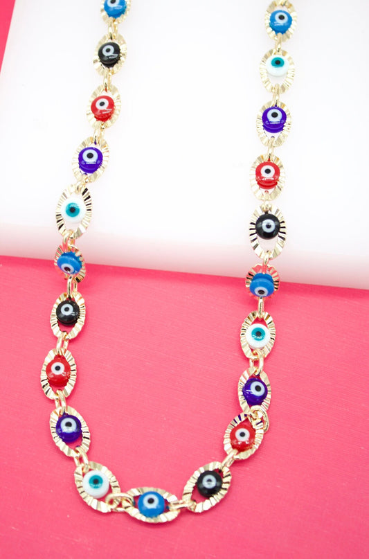 A gold link chain necklace features colorful evil eye beads in shades of blue, red, purple, and black.