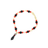 A gold chain bracelet features alternating red and black beads and hangs with a black figa charm against a white background.