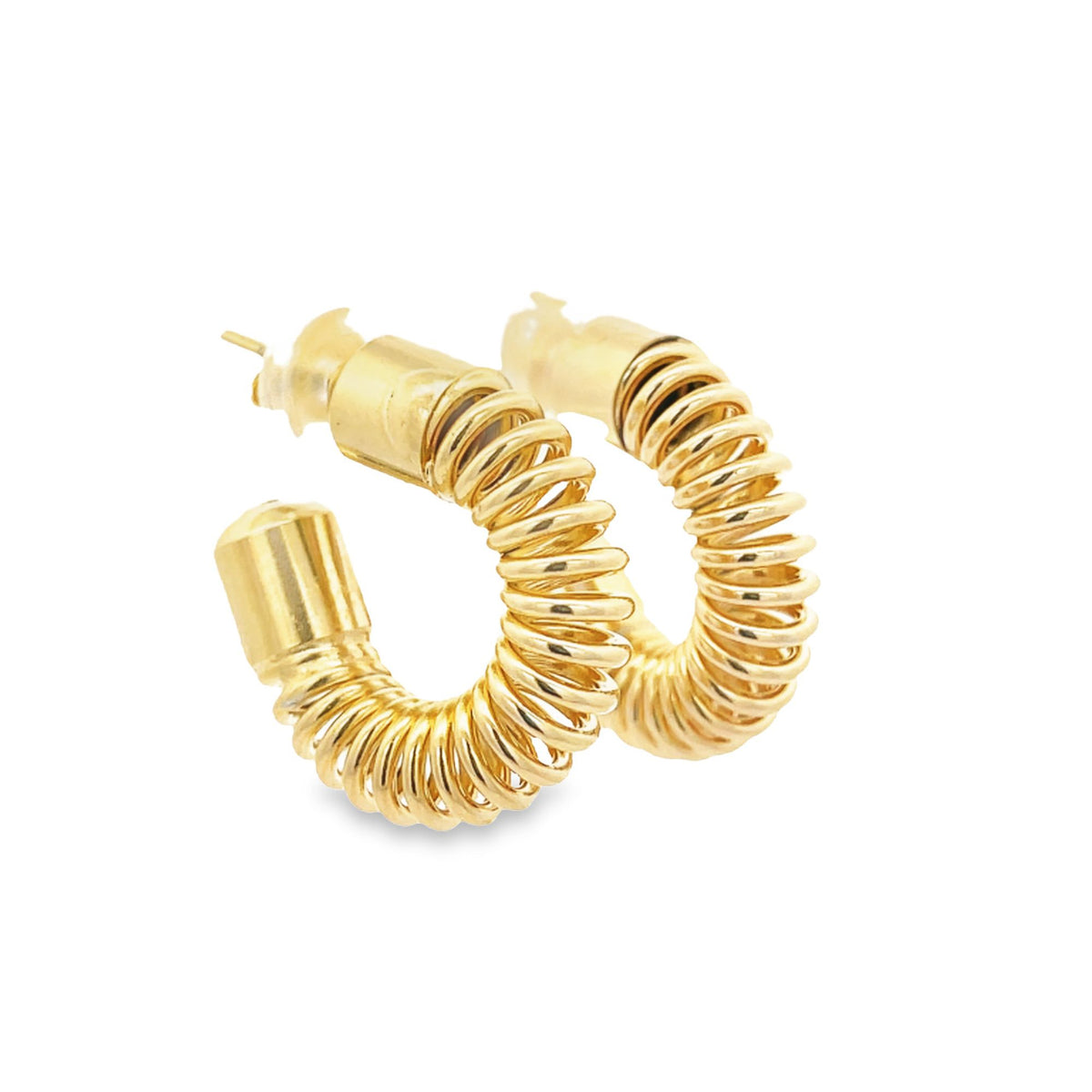 A pair of chunky gold hoop earrings featuring a unique spiral coil design rest against a clean white background.