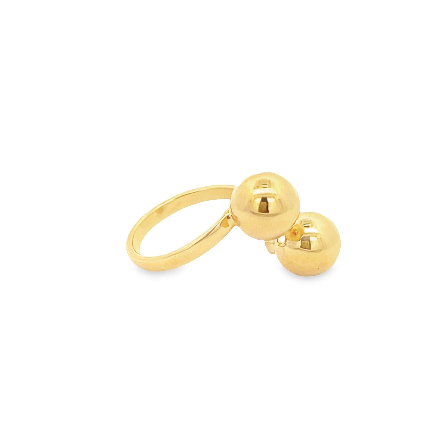 A sleek gold ring features two polished spherical beads resting on a plain white background.