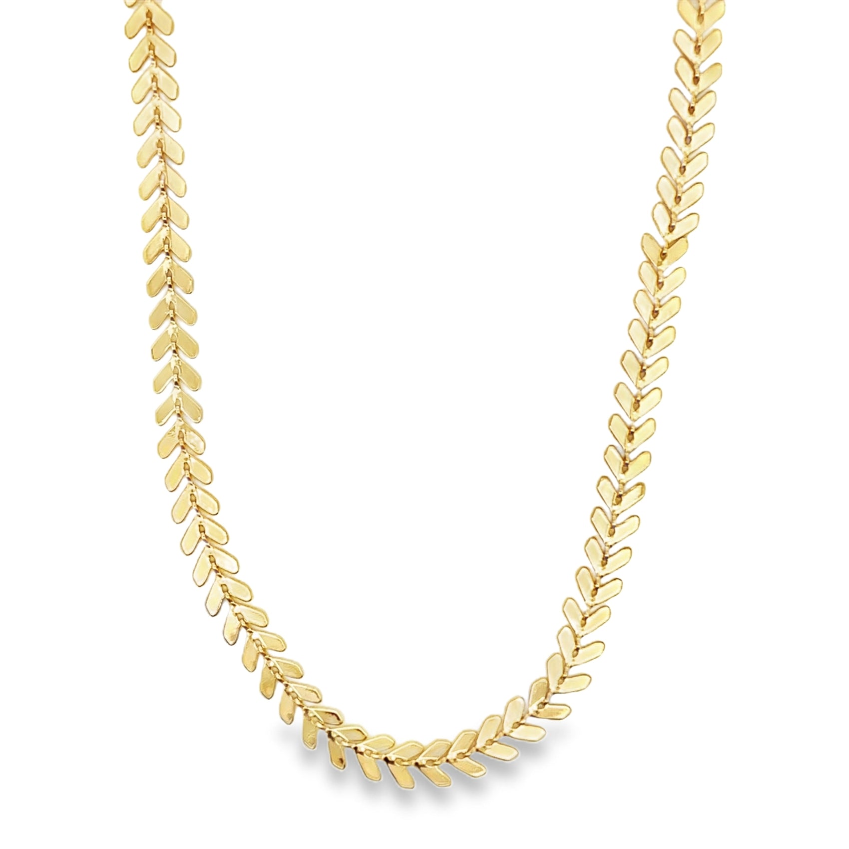 A delicate gold herringbone chain necklace curves gracefully against a clean white background.