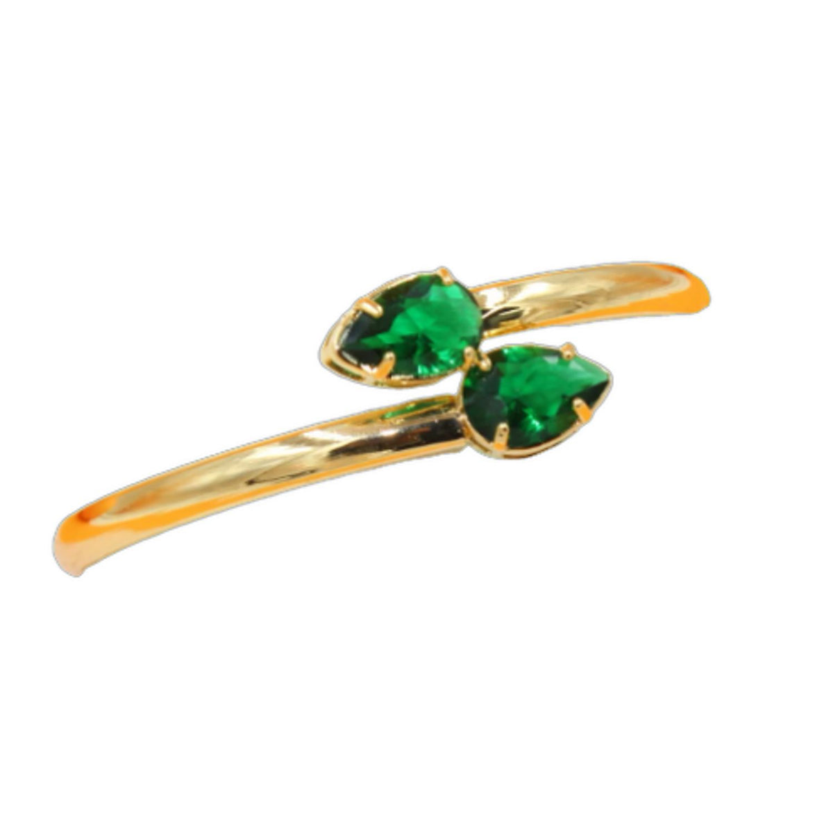 A gold bypass ring features two pear-cut emerald gemstones facing each other against a clean white background.