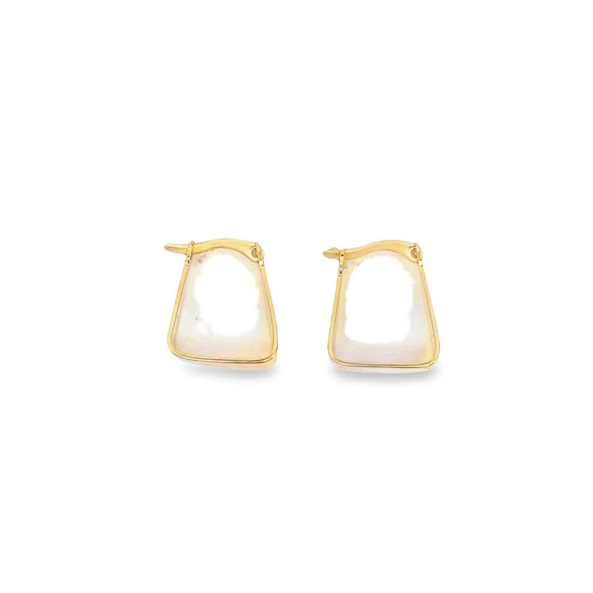 A pair of geometric gold hoop earrings with white enamel inlay rests against a clean white background.
