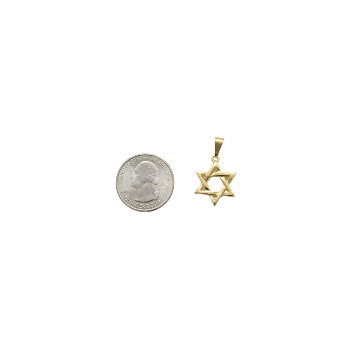 A gold Star of David pendant rests beside a US quarter coin to display its actual size.
