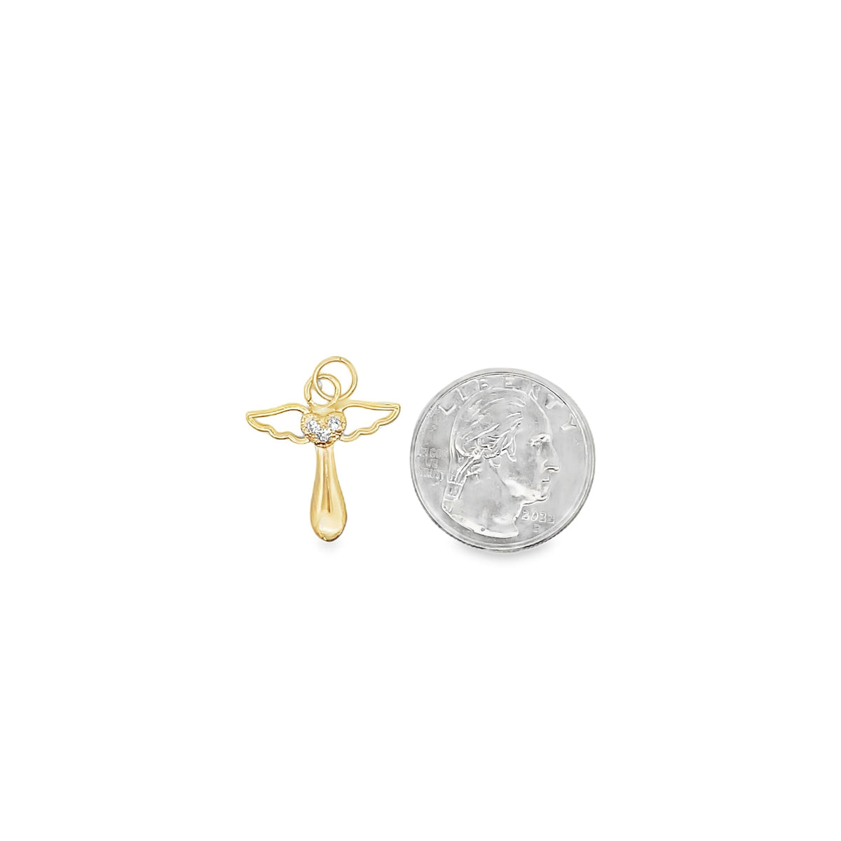A delicate gold angel pendant with a diamond-accented heart rests beside a US quarter for scale.