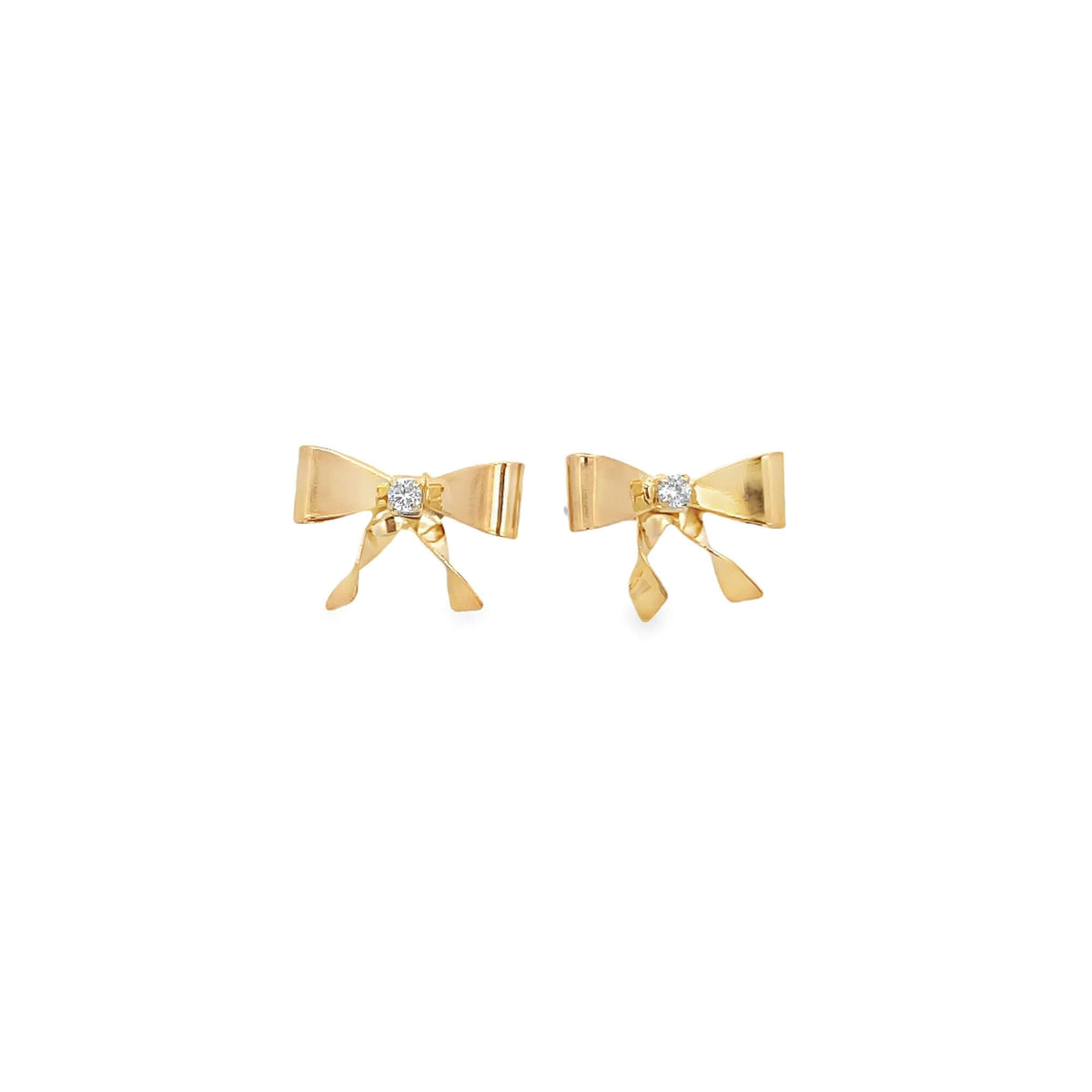 A pair of elegant gold bow earrings sparkle with central diamonds against a clean white background.
