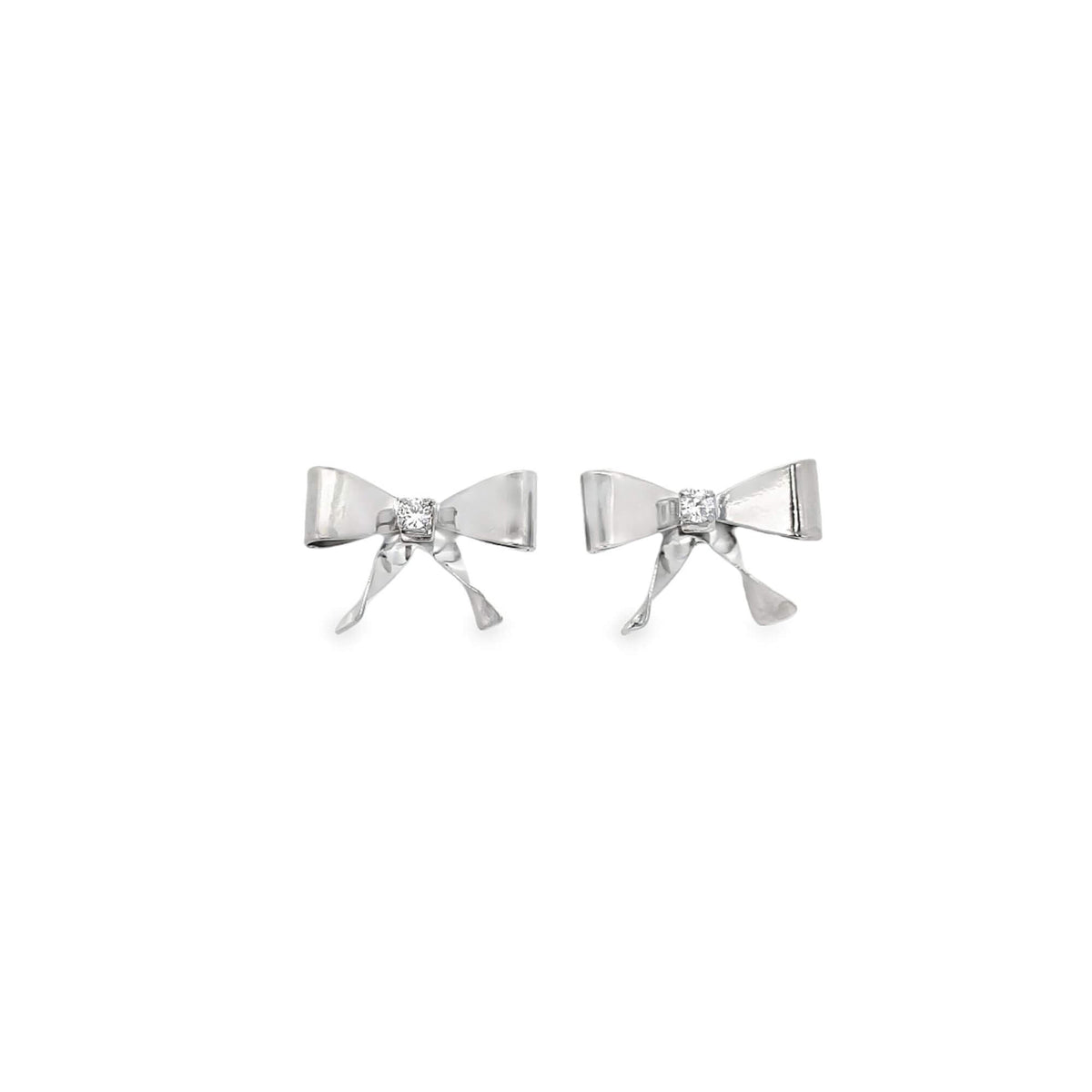 A pair of silver bow earrings sparkle with a central diamond accent against a clean white background.