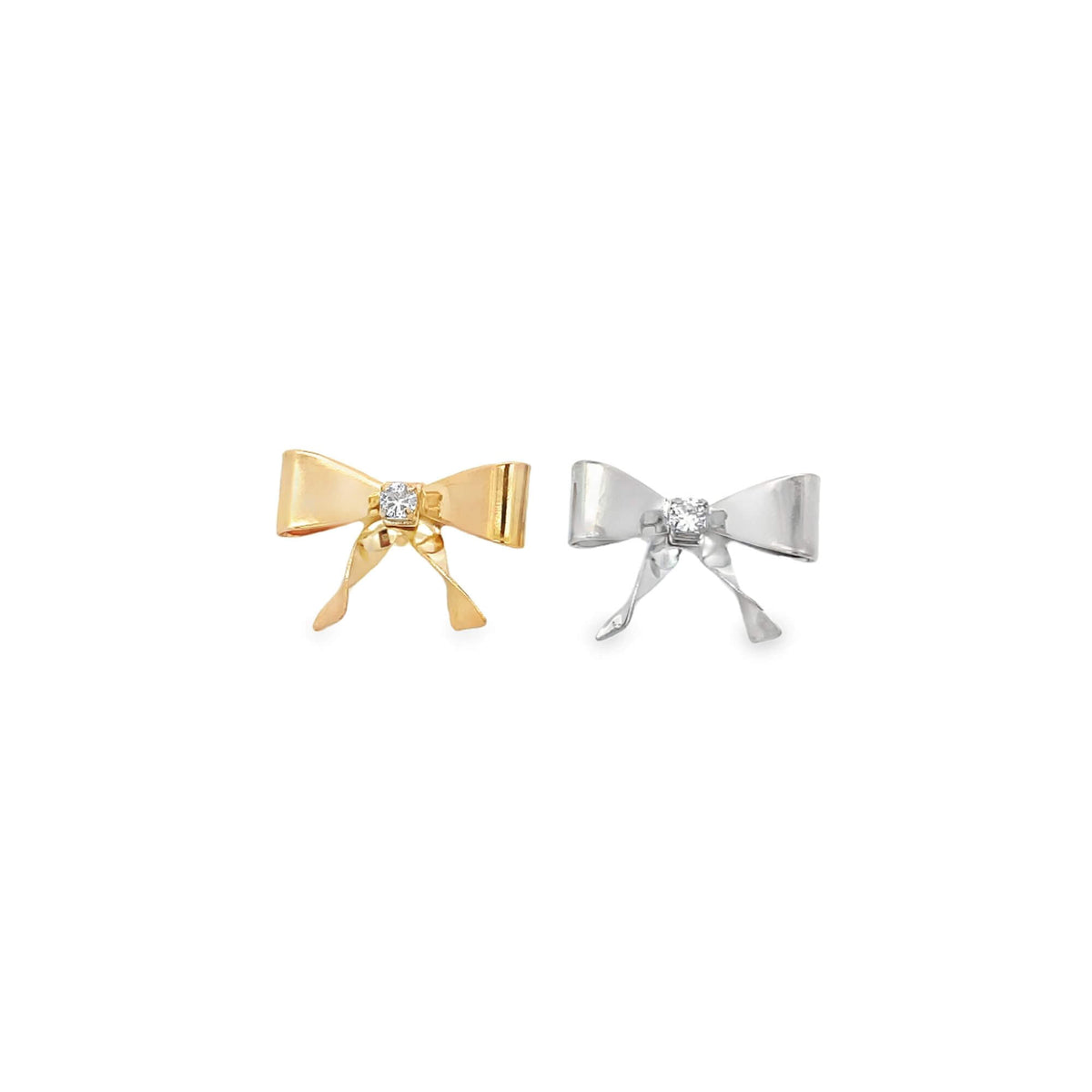 Two delicate bow-shaped earrings, one in yellow gold and the other in silver, each sparkle with a central diamond accent against a clean white background.