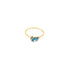 A delicate gold ring showcases a marquise-cut blue topaz gemstone flanked by tiny sparkling diamonds against a clean white background.
