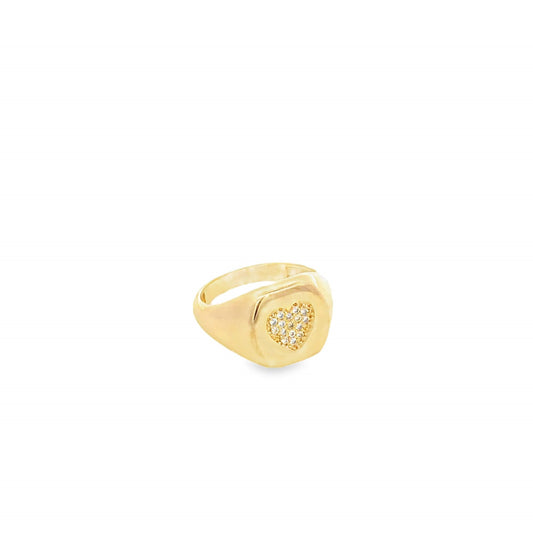 A gold signet ring features a sparkling diamond-pave heart motif centered on a smooth, polished band.