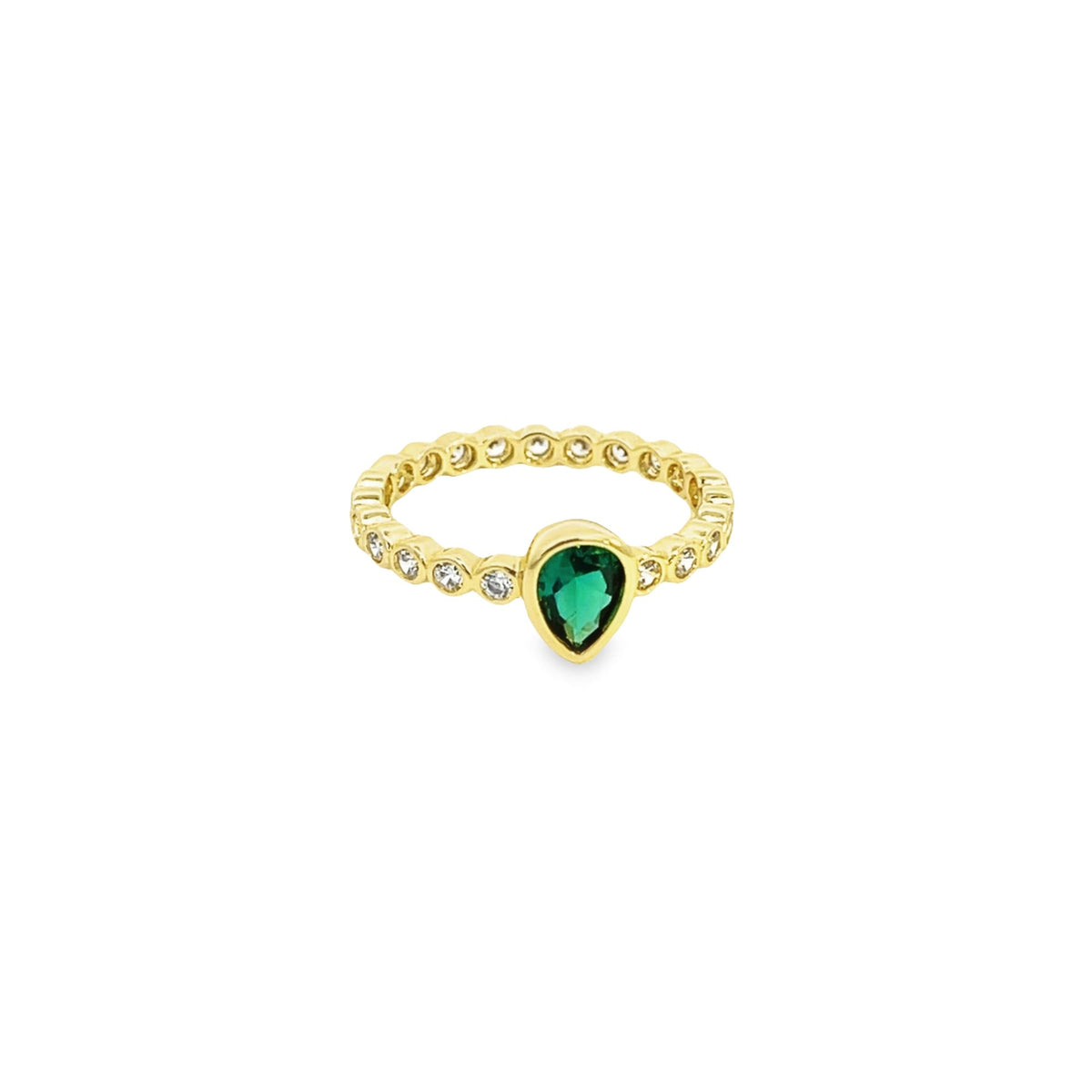 A gold band ring showcases a vibrant pear-shaped green gemstone flanked by sparkling diamond accents.