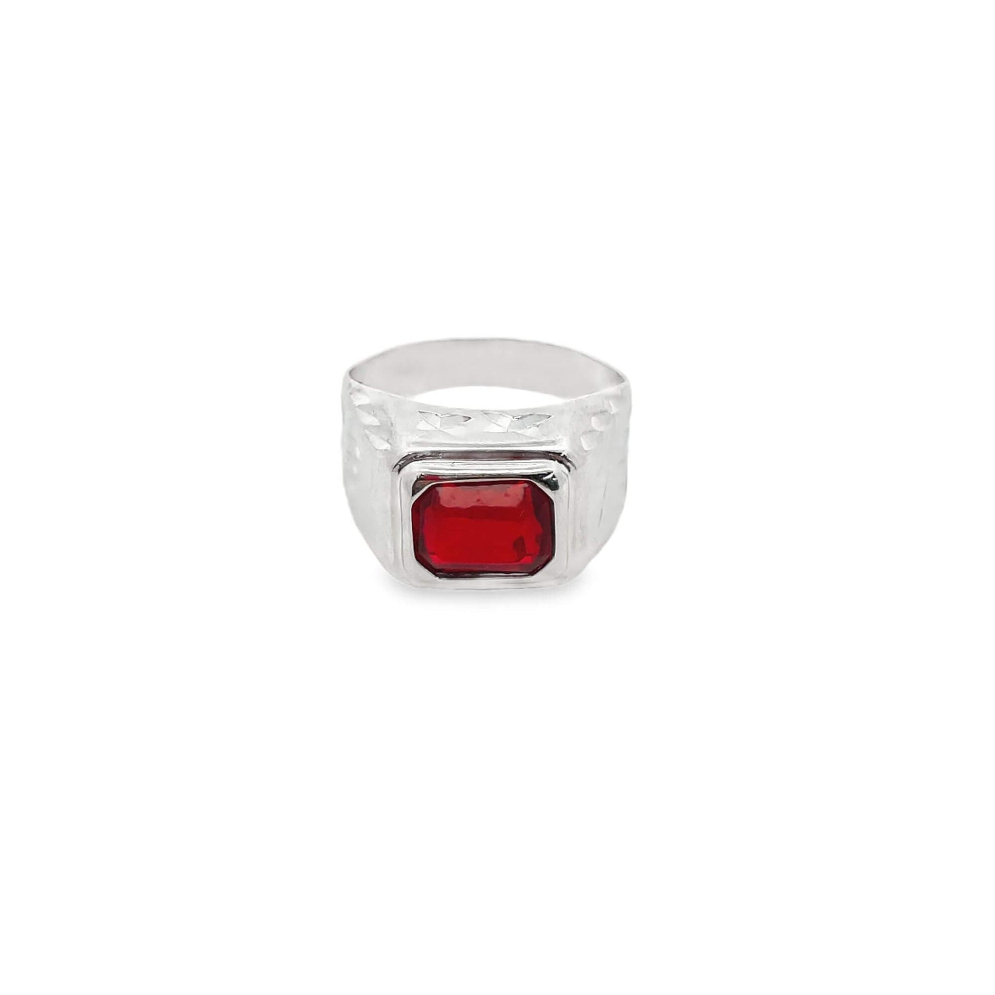 A polished silver ring features a vibrant rectangular red gemstone centered on a textured band against a plain white background.