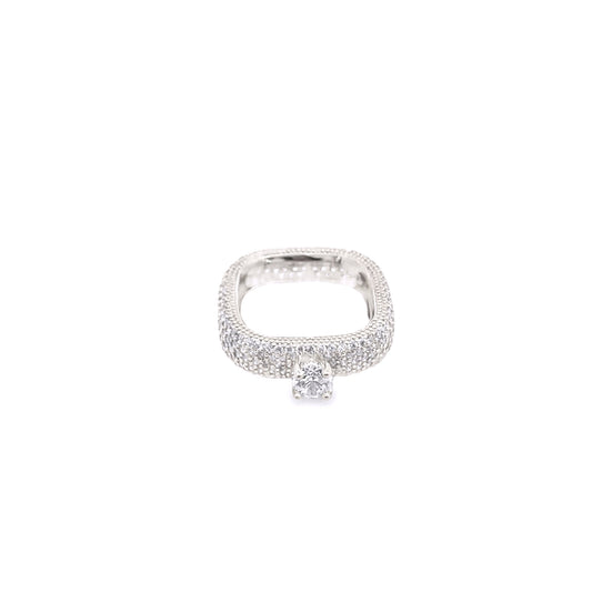 A unique square-shaped silver diamond engagement ring features pavé-set stones and a brilliant center solitaire.