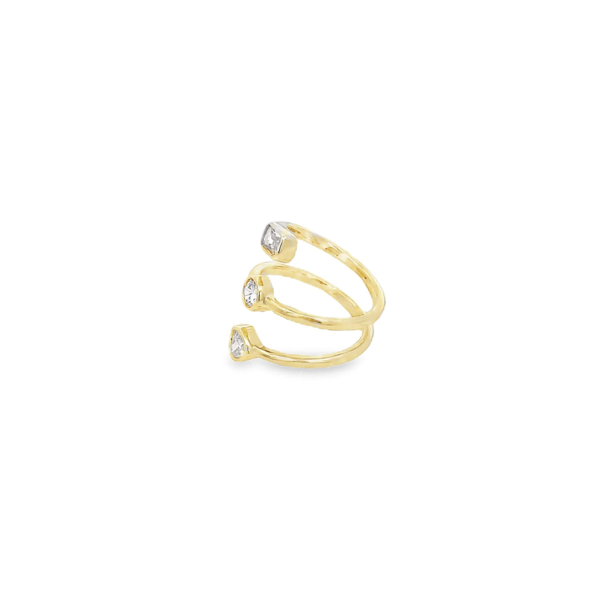 A gold triple-band bypass ring sparkles with three bezel-set diamonds against a clean white background.