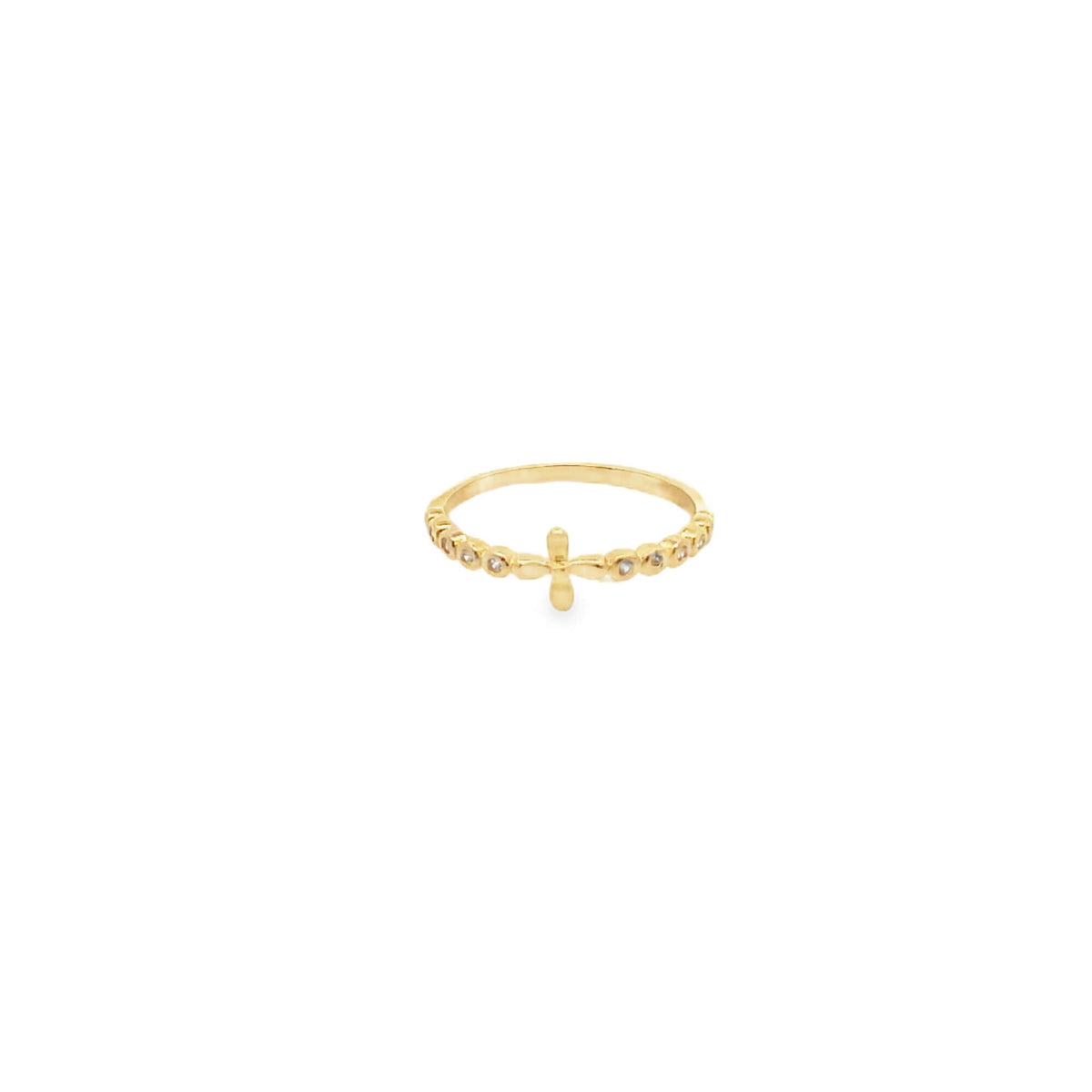 A delicate gold ring features a small cross detail and sparkling inset stones along the band.