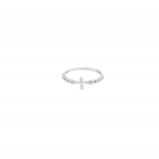 A delicate silver ring features a small cross centerpiece flanked by sparkling stone accents on a clean white background.