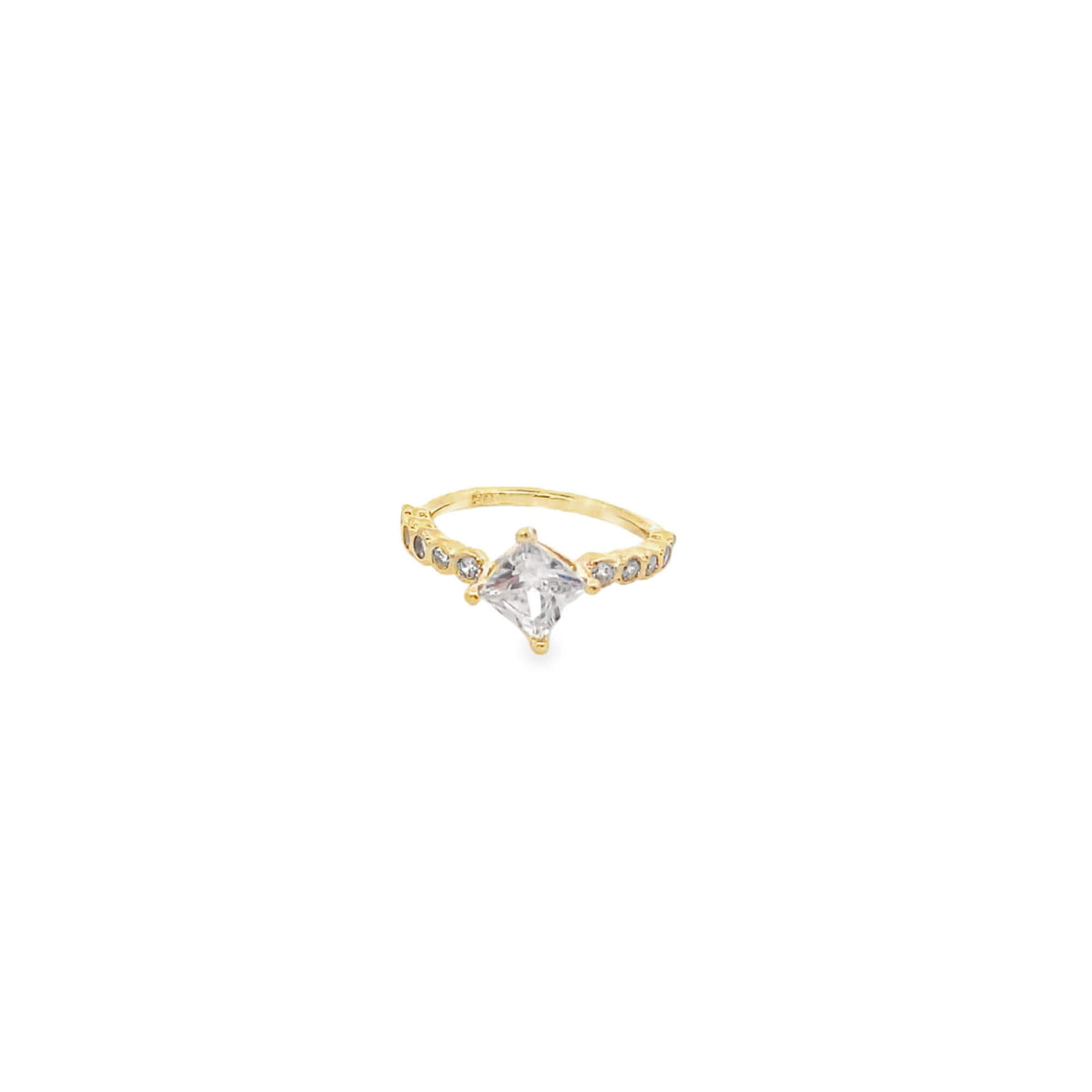 A gold ring features a central princess-cut diamond accented by smaller diamonds along the band.