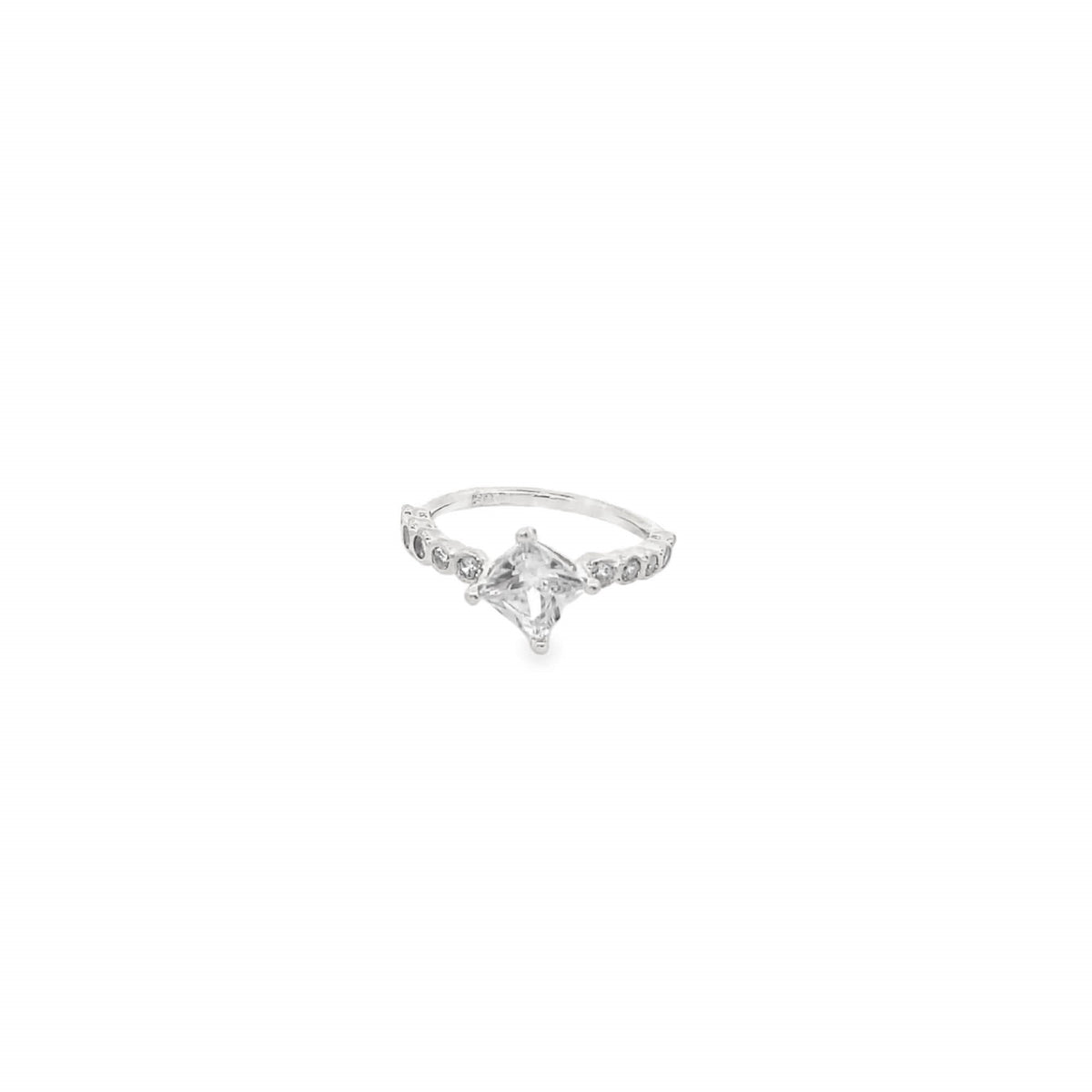 A delicate silver ring features a sparkling princess-cut diamond centerpiece flanked by pave-set crystals along the band.