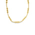 A gleaming gold bead necklace rests in a gentle curve against a clean white background.