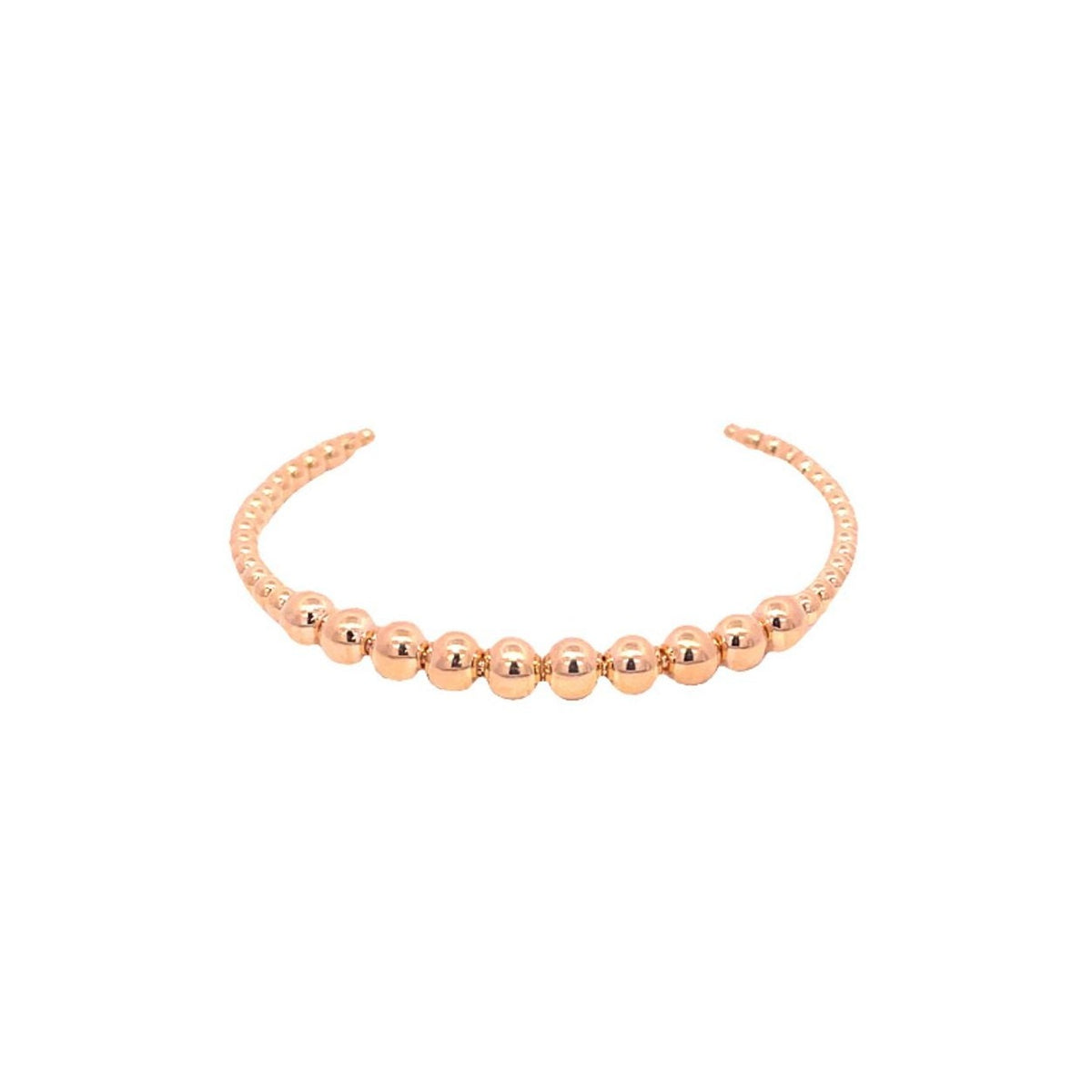 A polished rose gold beaded cuff bracelet rests against a clean white background.