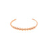 A polished rose gold beaded cuff bracelet rests against a clean white background.