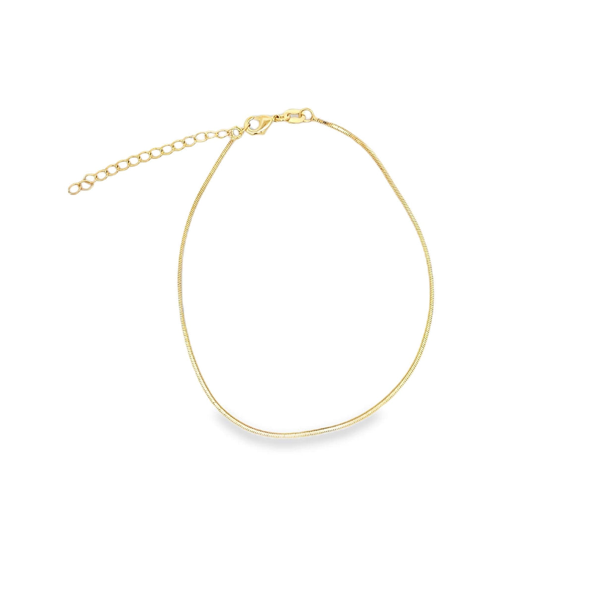 A delicate gold snake chain anklet features a secure lobster clasp and an adjustable extension chain against a clean white background.