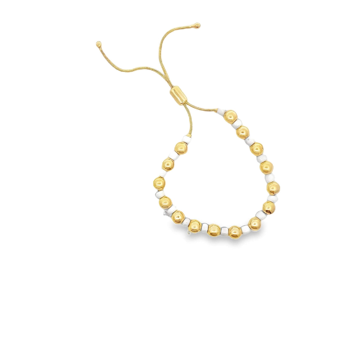 An adjustable gold-plated slider bracelet features alternating shiny gold and white beads against a clean white background.