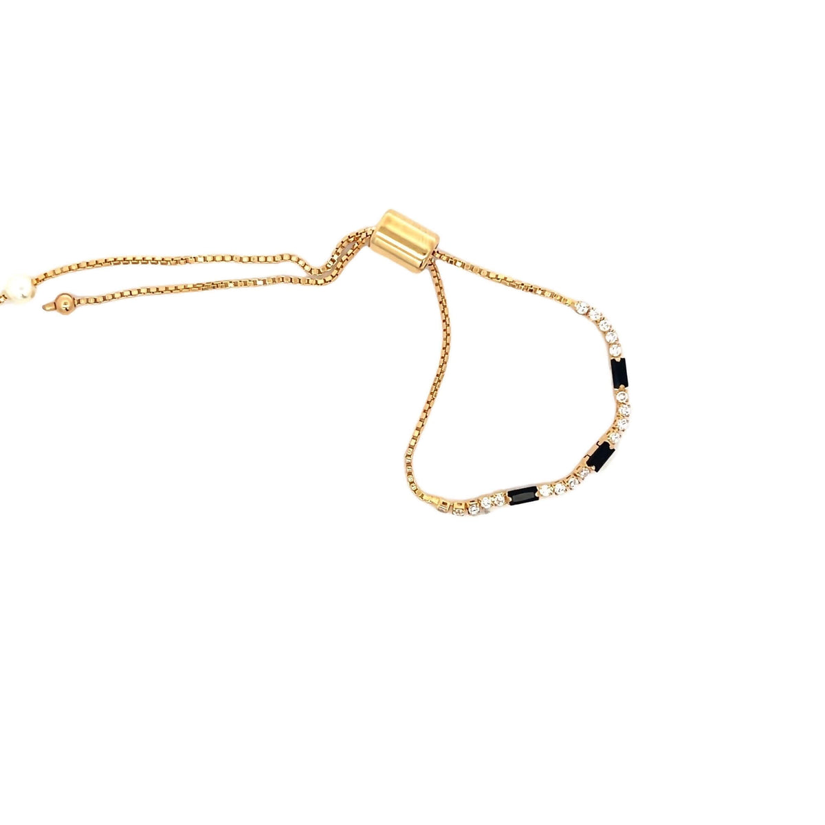 An adjustable gold slider bracelet features alternating clear crystals and black rectangular stones.