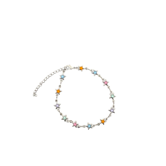 A silver-tone charm bracelet features colorful enamel star accents and an adjustable chain.