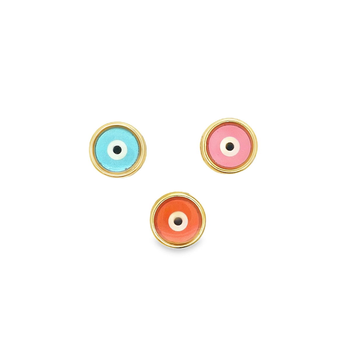 Three gold evil eye stud earrings featuring colorful enamel in blue, pink, and orange rest against a clean white background.