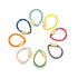 A colorful assortment of teardrop-shaped enamel charm connector rings arranged in a circle on a white background.