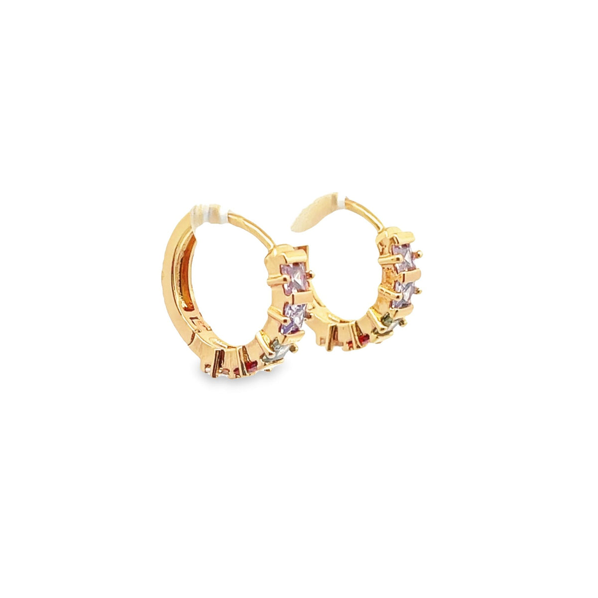 A pair of gold huggie hoop earrings features sparkling multi-colored gemstones against a clean white background.