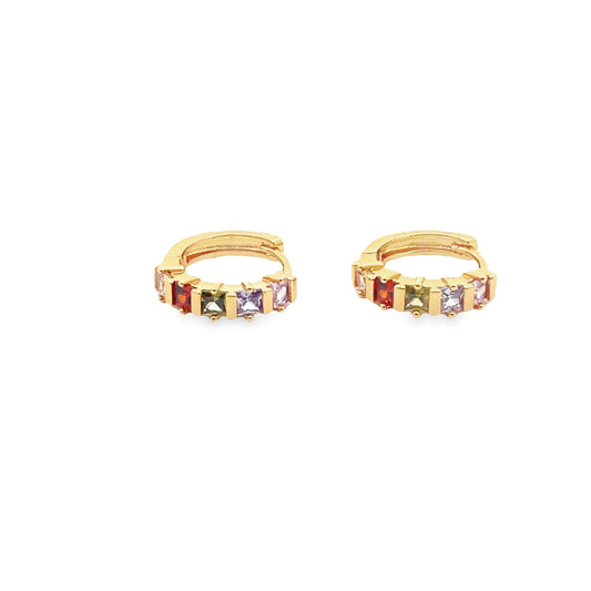 A pair of gold huggie hoop earrings showcase a vibrant row of multicolored square gemstones against a clean white background.