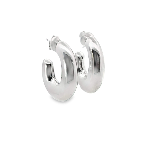A pair of glossy silver chunky hoop earrings rests against a clean white background.