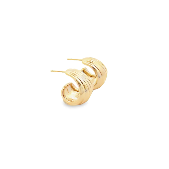 A pair of shiny gold croissant dome hoop earrings rests on a clean white background.