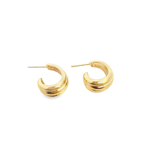 A pair of shiny gold-plated double-band huggie hoop earrings rests against a clean white background.