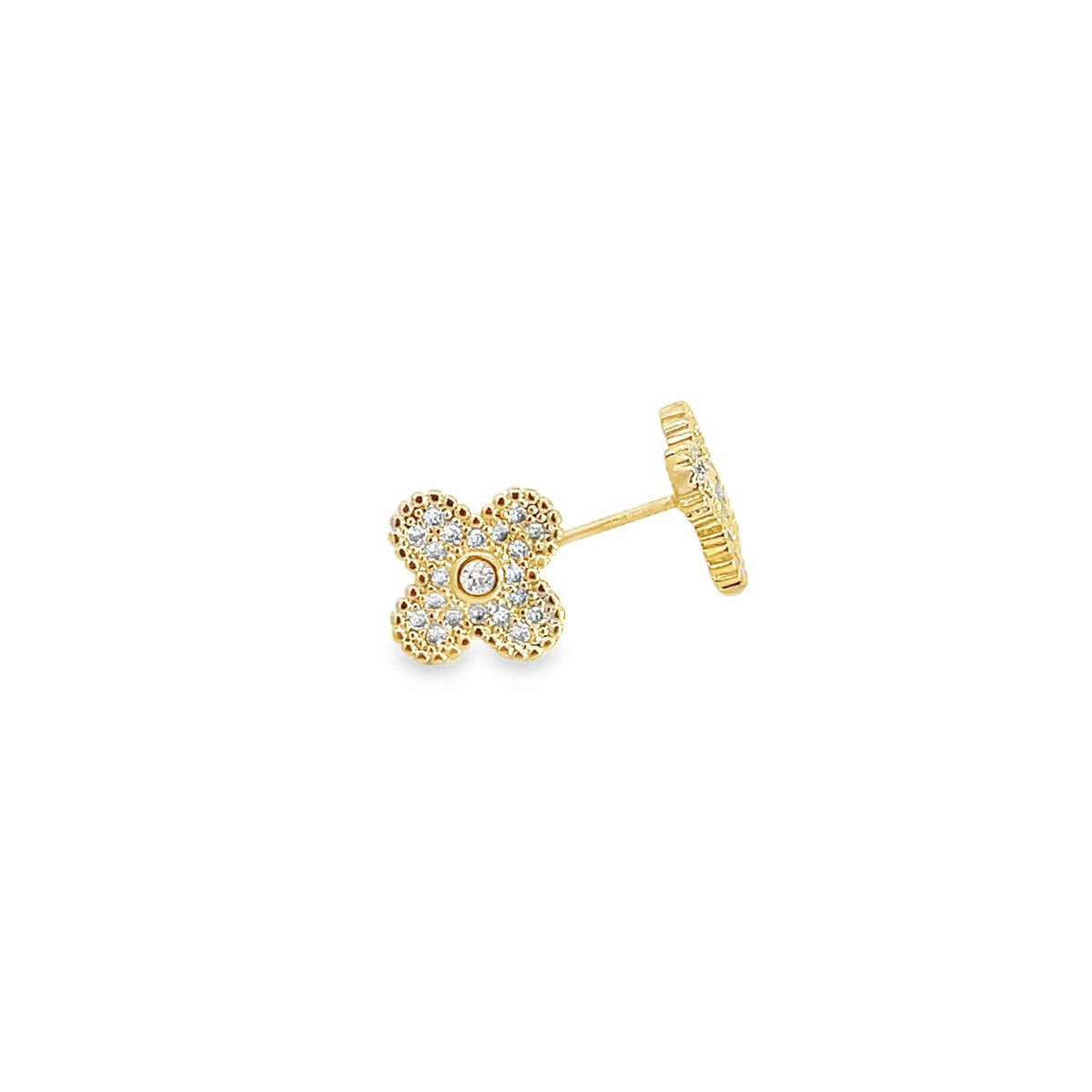 A dainty gold stud earring shaped like a four-leaf clover sparkles with inset diamonds against a clean white background.